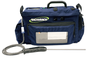 Bacharach gas analyser in a blue soft carrying case with a metal probe and hose attachment.