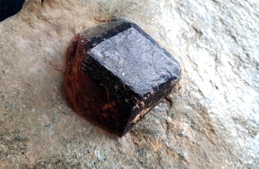A garnet crystal in a schist matrix
