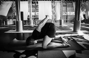 A practitioners executes a modified version of Yoga Mudra