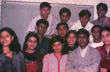 a group of people standing around a table