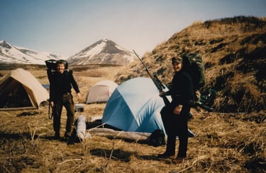 A&L Outdoors Alaska hunting base camp with multiple tents and hunters prepared for an expedition.