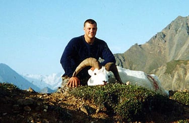 Successful Alaskan Dall Sheep expedition showing a trophy harvest in the high country.
