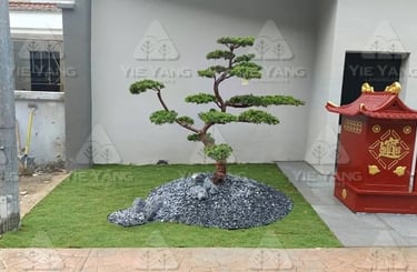 Bonsai pine tree with grey rocks and artificial turf – Yie Yang Landscape