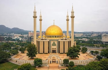 National Mosque of Abuja in Nigeria with its golden dome and tall minarets, a major religious center in West Africa.