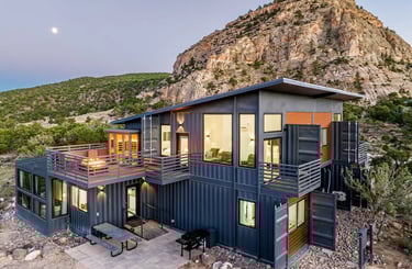 a container house with a mountain view of a mountain