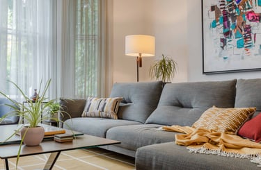 Roche Bobois sofa and beautiful Kvadrat Kilim rug seen in this image 