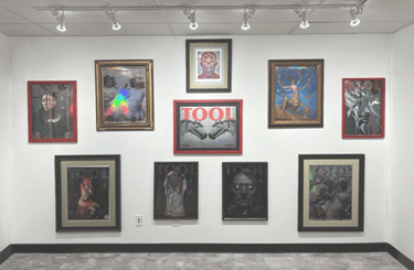 Collection of framed Tool band concert posters custom framed on a white gallery wall.