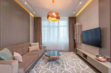 A sofa and a coffe table with a tv in a living room