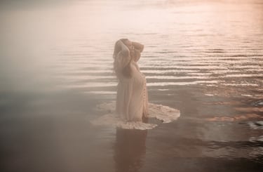 Dreamy maternity photo of mother standing in the water, Grand Rapids MN