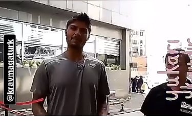 a man in a gray shirt and a man in a black shirt
