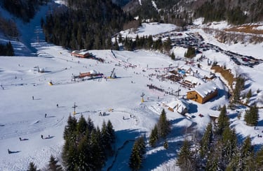 Aerial view of Kolasin 1450 ski center under snow in Montenegro