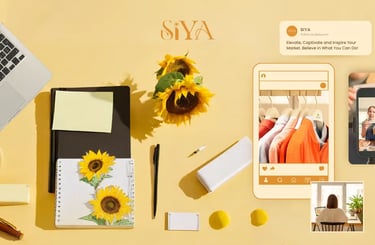 a desk with laptop computer, stationery, pens and sunflowers while viewing social media content