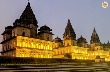 Orchha's illuminated cenotaphs under the night skies.