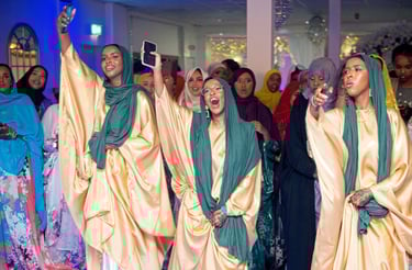Somalian bridesmaids dancing, having a good time, wearing traditional clothes 