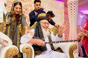 candid photo of bride's grandfather, he is laughing and smiling 