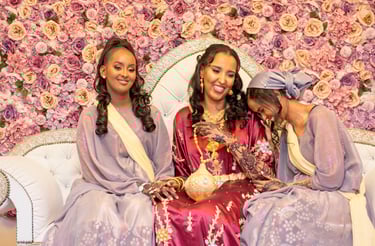 candid photo of Somalia n bridesmaid laughing and smiling with bride 