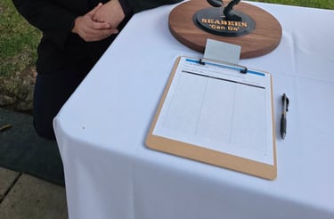 Our founder, next to a donated statue up for auction, with proceeds going to the annual Seabee Ball