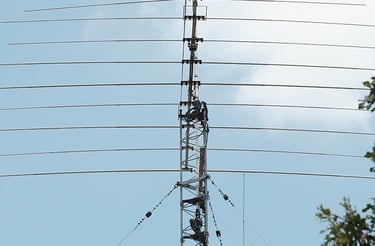 My amateur radio NA4M tower with antennas against the sky, used for receiving and transmitting signals around the world