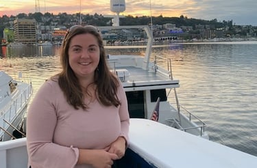 Lauren Ing standing on a boat in the water