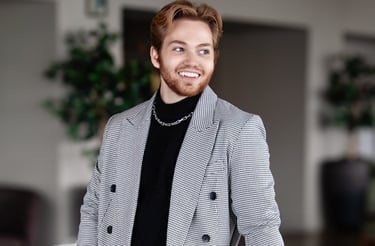 a man in a suit and a suit jacket