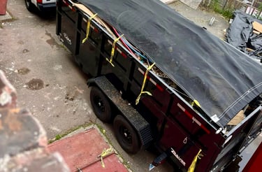 a truck with a tarp on it and a truck with a tarp on