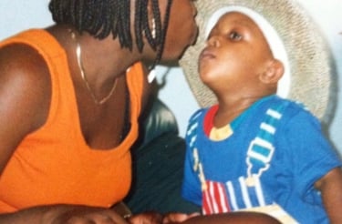 Black Mother kissing her son 