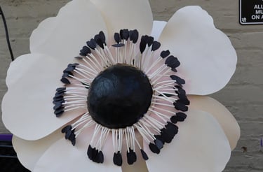 a paper flower with black and white flowers