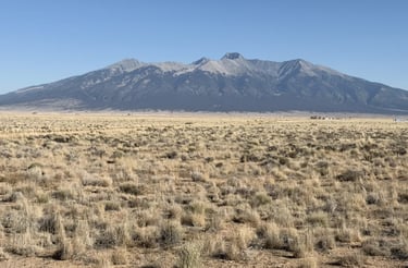 a mountain view of a mountain range with a mountain in the background