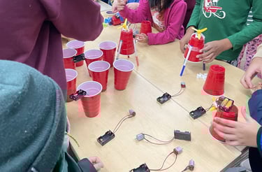 a group of student building drawing bots