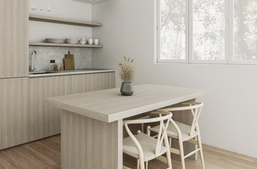 a kitchen with a table and chairs and a vase with a vase with flowers