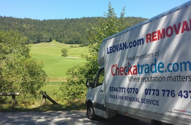 Leovan removals van parked in fields
