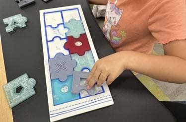 blind student uses tactile discrimination skills to assemble a tactile puzzle