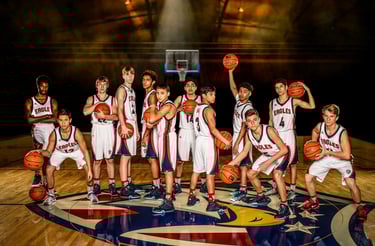 a group of young boys and girls basketball players posing for a photo