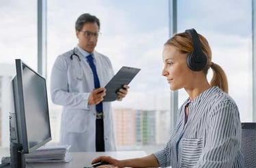a doctor and a transcriptionist in pointscription office