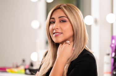 a woman with blonde hair and a ring on her finger