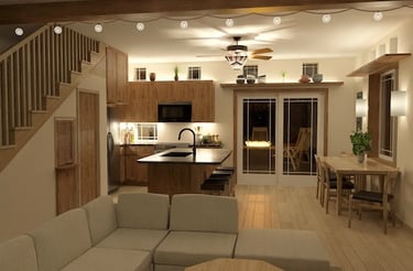Interior view of a living room and dining room, looking through glass doors onto a patio with a fire