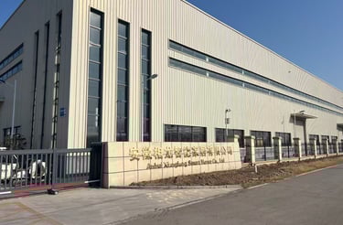 a large building with a fenced in area with a fence