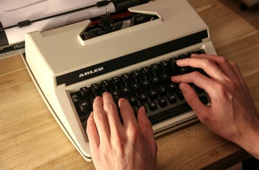 typewriter, two hands are typing