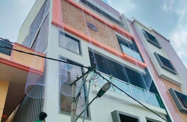 A technician installing a sturdy pigeon net on an apartment balcony in Anna Nagar.