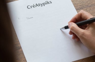 Cozy workspace with handmade scarves and a laptop ready for customer messages.