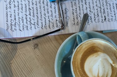 handwritten text and coffee cup