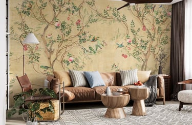 Floral wallpaper in a living room with a couch and a ceiling fan