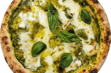 Fresh Neapolitan pizza with pesto sauce, melted mozzarella cheese, and green basil leaves.
