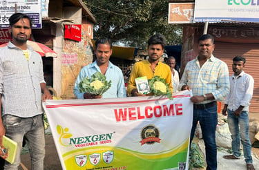 Farmers holding fresh cauliflower and a Nexgen Vegetable Seeds banner at a local Uttarakhand market.