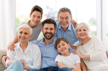 a family of four people sitting on a couch