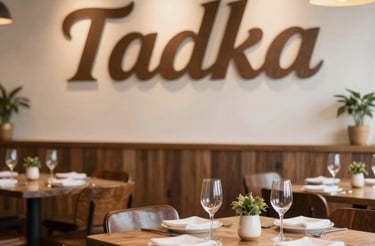 A warm, inviting photo of Tadka's cozy dining area with traditional Hyderabadi decor.