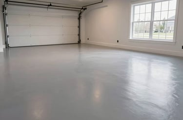 A sleek epoxy-coated garage floor reflecting soft overhead lighting in a modern Ontario home.