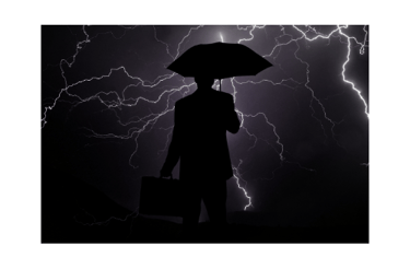 A person with an umbrella in a storm, symbolizing overcoming challenges