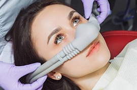 Sedation being administered for a woman in a dental device