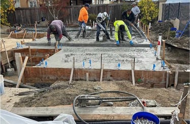 Crew working on concrete adu